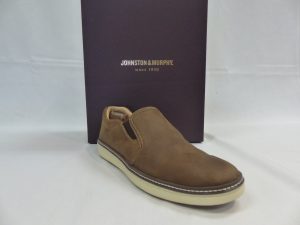 Brown loafer shoe sitting in front of box that says “Johnston & Murphy”